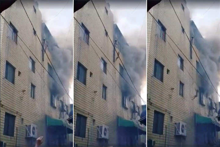 لإنقاذهم من ألسنة النيران أم ترمي أبناءها من نافذة الطابق 4 -فيديو