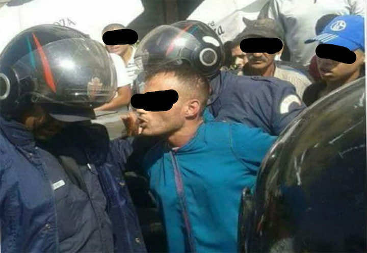 اعتقال مجرم يتخفى في ملابس نسائية - الصورة