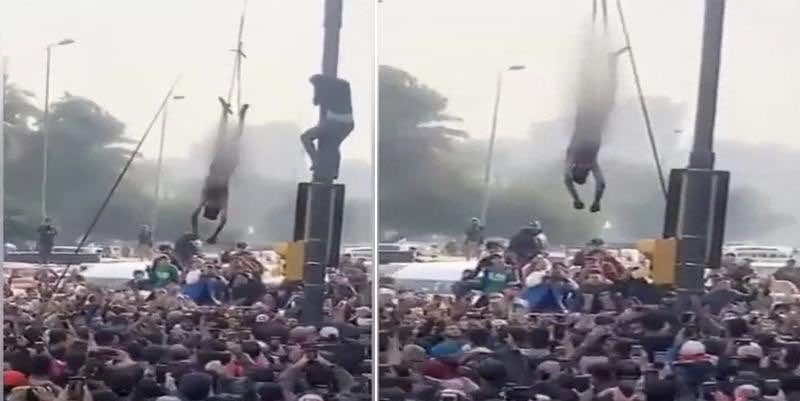 جريمة وحشية.. محتجون عراقيون يقتلون شابا ويعلقون جثته على عمود في بغداد